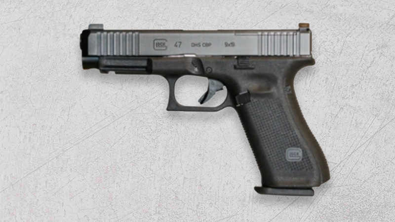 A black Glock 47 DHS CBP 9mm resting on a white surface