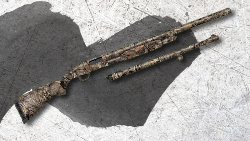 A military print Mossberg 500 shotgun on a white backdrop